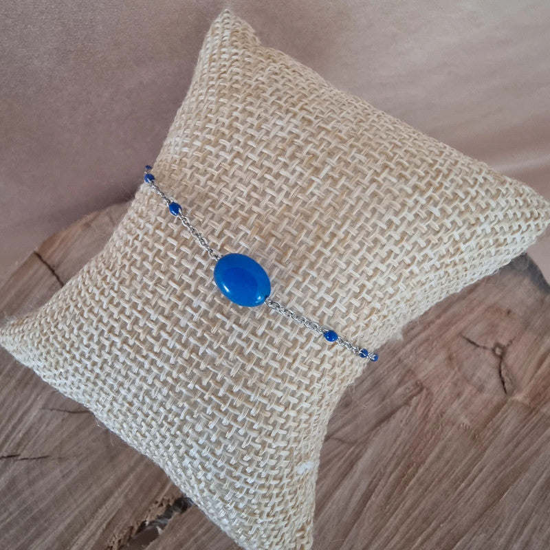 Bijou fantaisie élégant avec perle bleue centrale