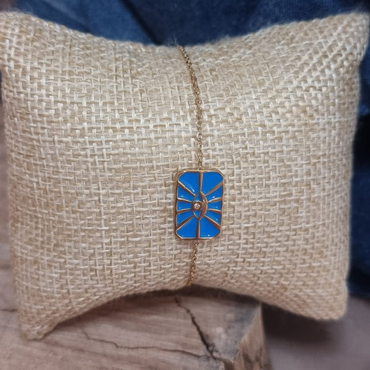 Bracelet doré avec plaque bleue œil protecteur et strass central